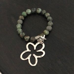 Stone bracelet with flower decal